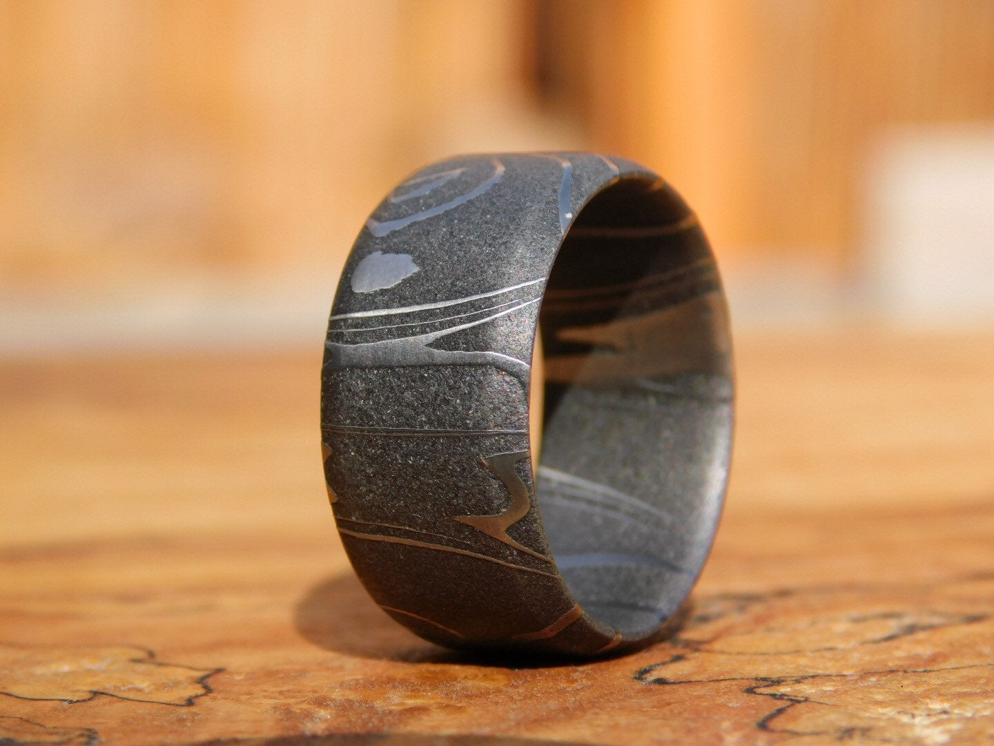 Petroglyph Carbon Damascus Ring